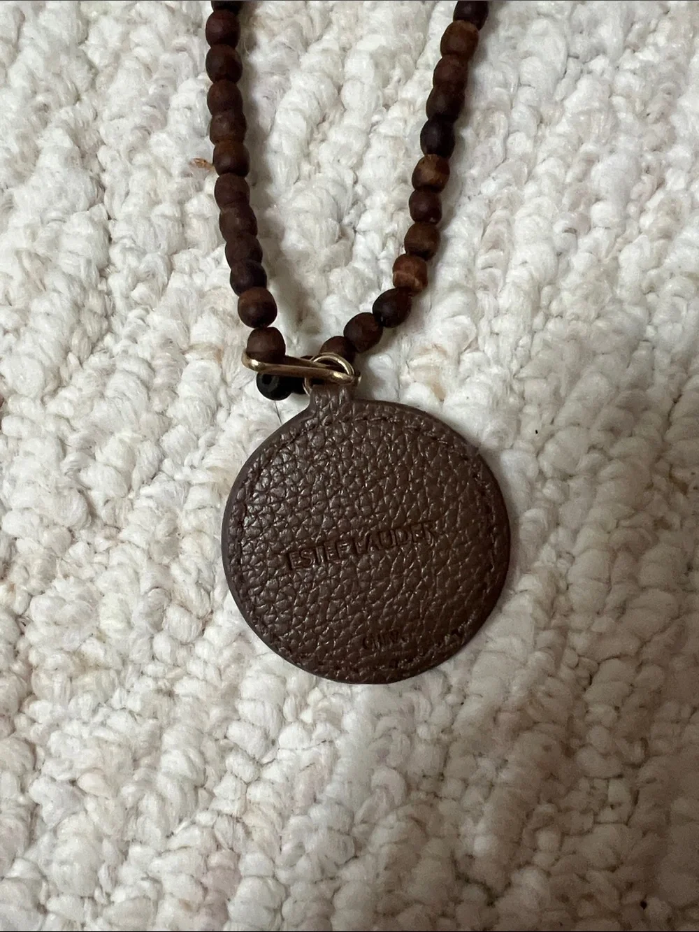 Estée Lauder Brown Wood Bead Necklace with Fox Pendant